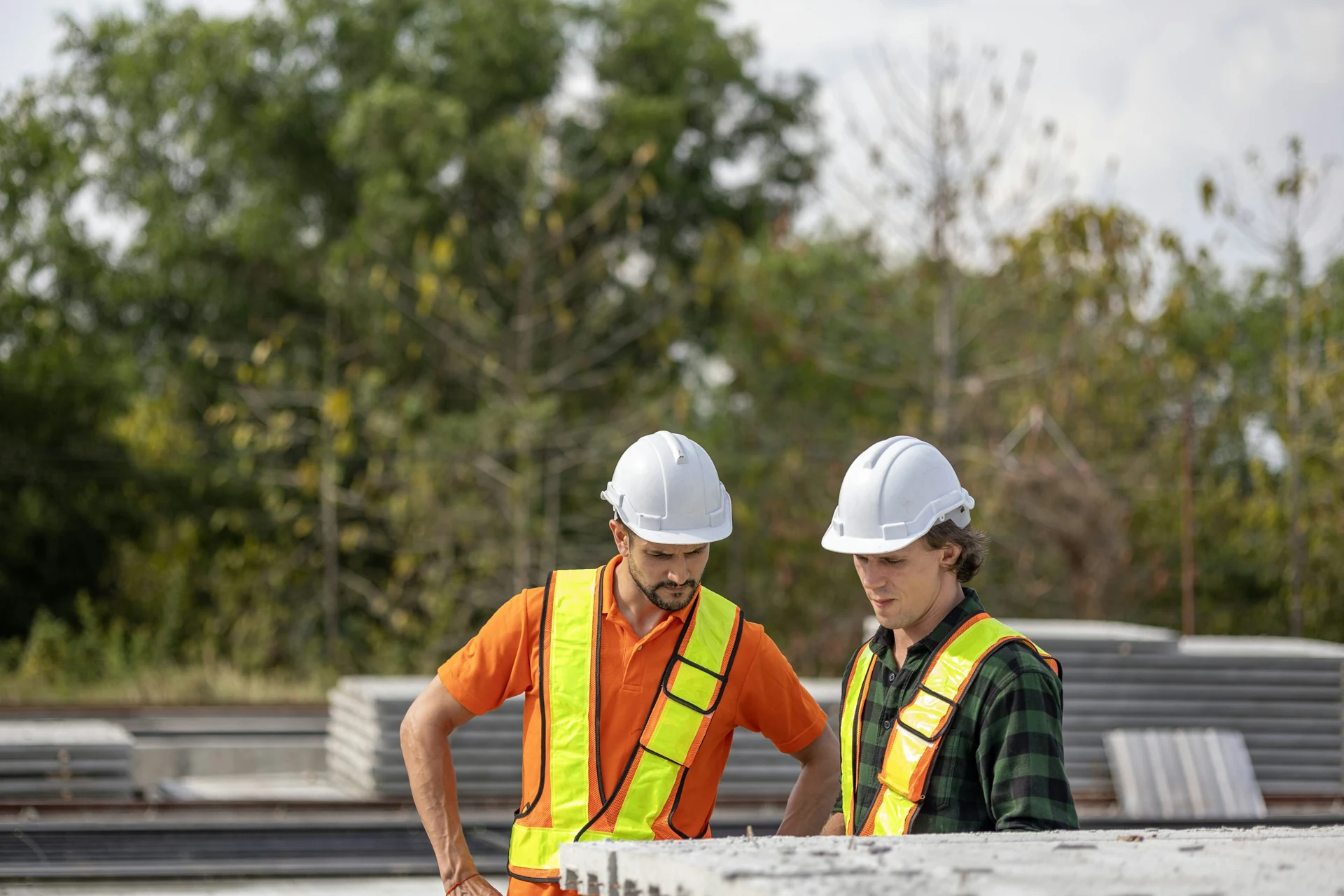 Trade business owners reviewing project plans