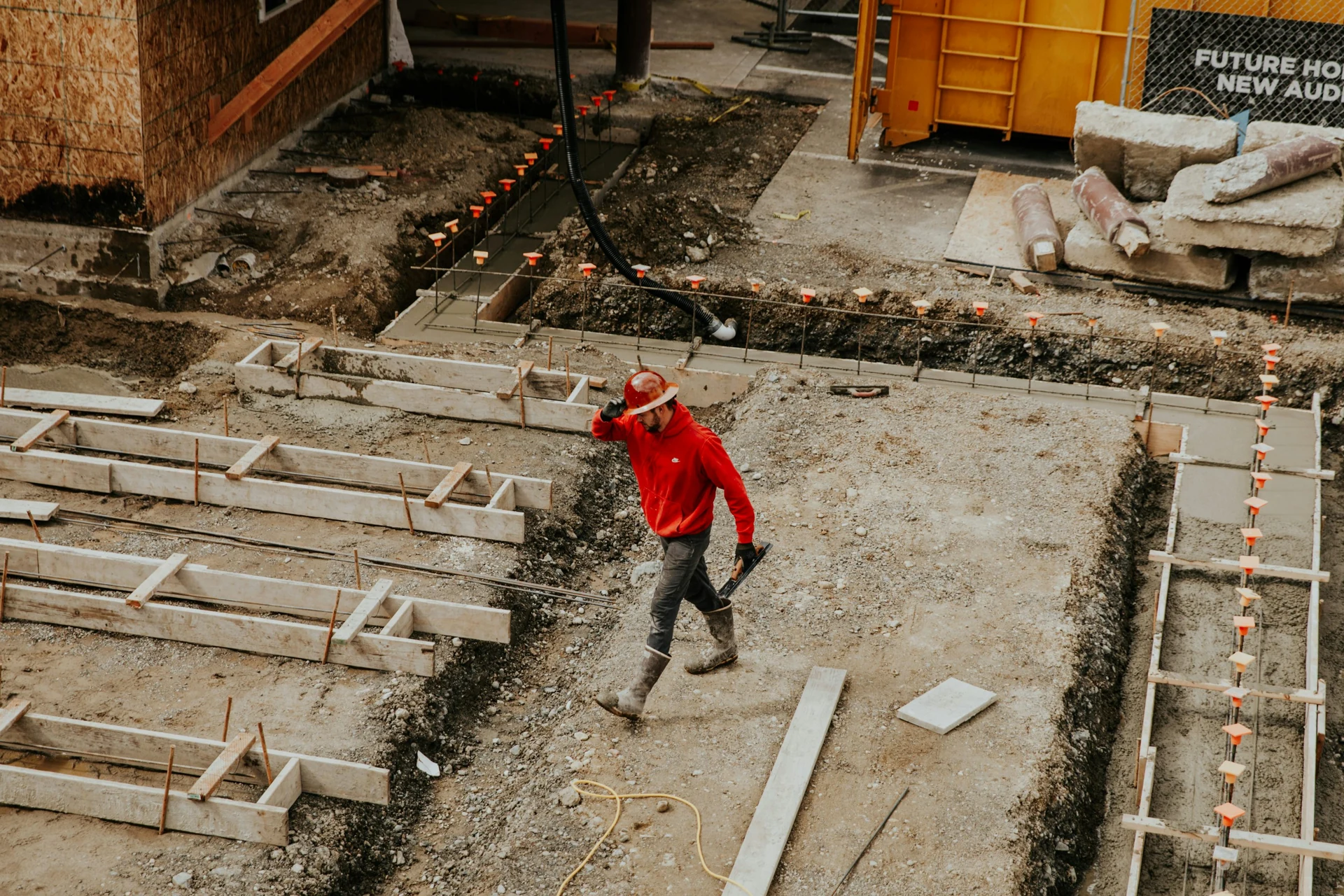 Construction equipment and crew on an active project